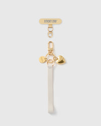 STICKYZOO golden heart leather phone strap — ivory Alran strap, gold-plated puffed heart charm and hardware