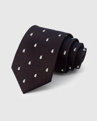 STICKYZOO Onyx Penguin Tie in hand-embroidered mulberry silk with white penguin motifs on onyx textured ground, 45° bias-cut Italian method