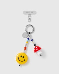 Handmade phone charm with yellow smiley face and red polka-dot mushroom on rainbow seed beads with silver-tone engraved STICKYZOO hardware