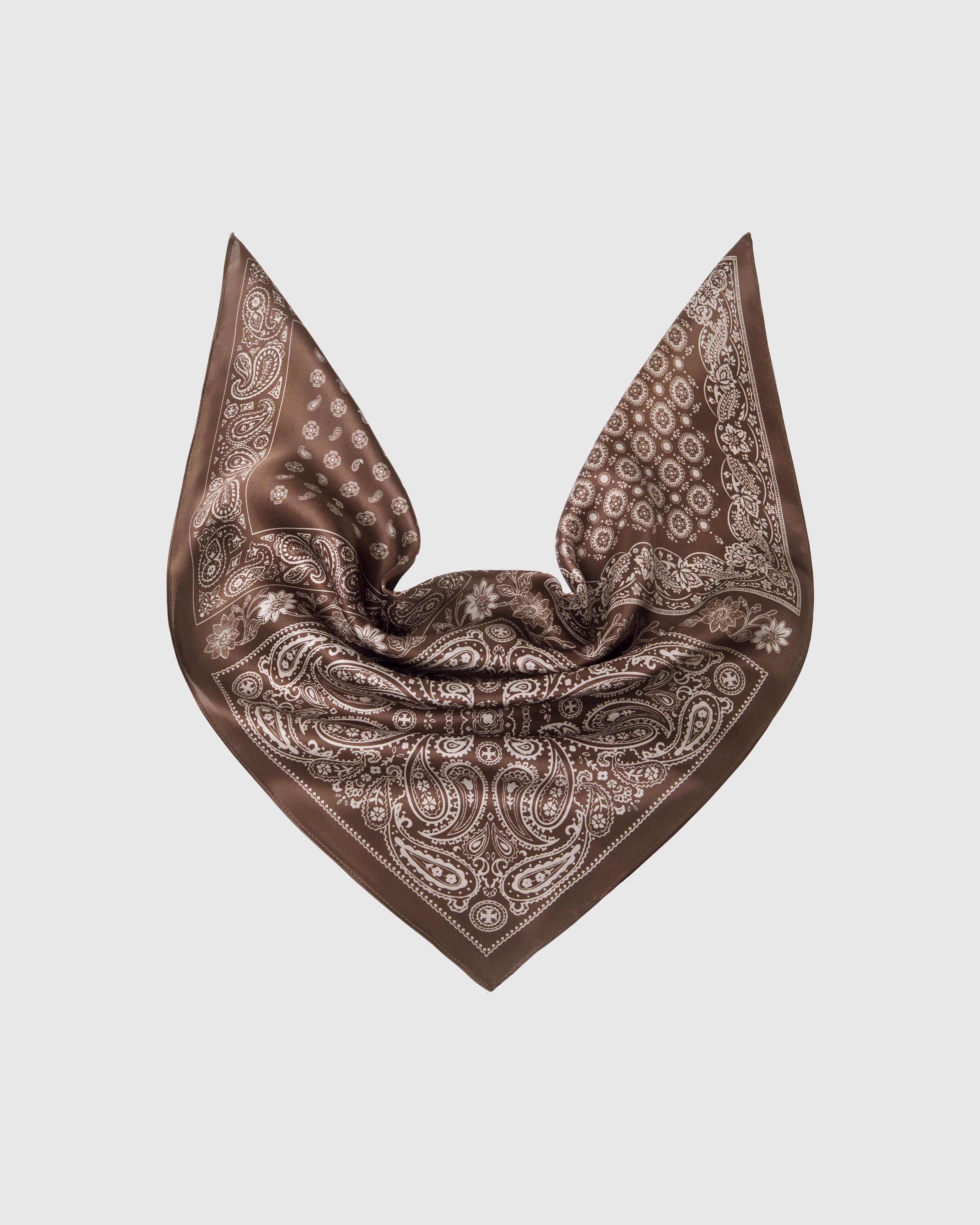 Cocoa silk scarf in a soft triangular drape showing the four paisley quadrants and ivory paisley framing