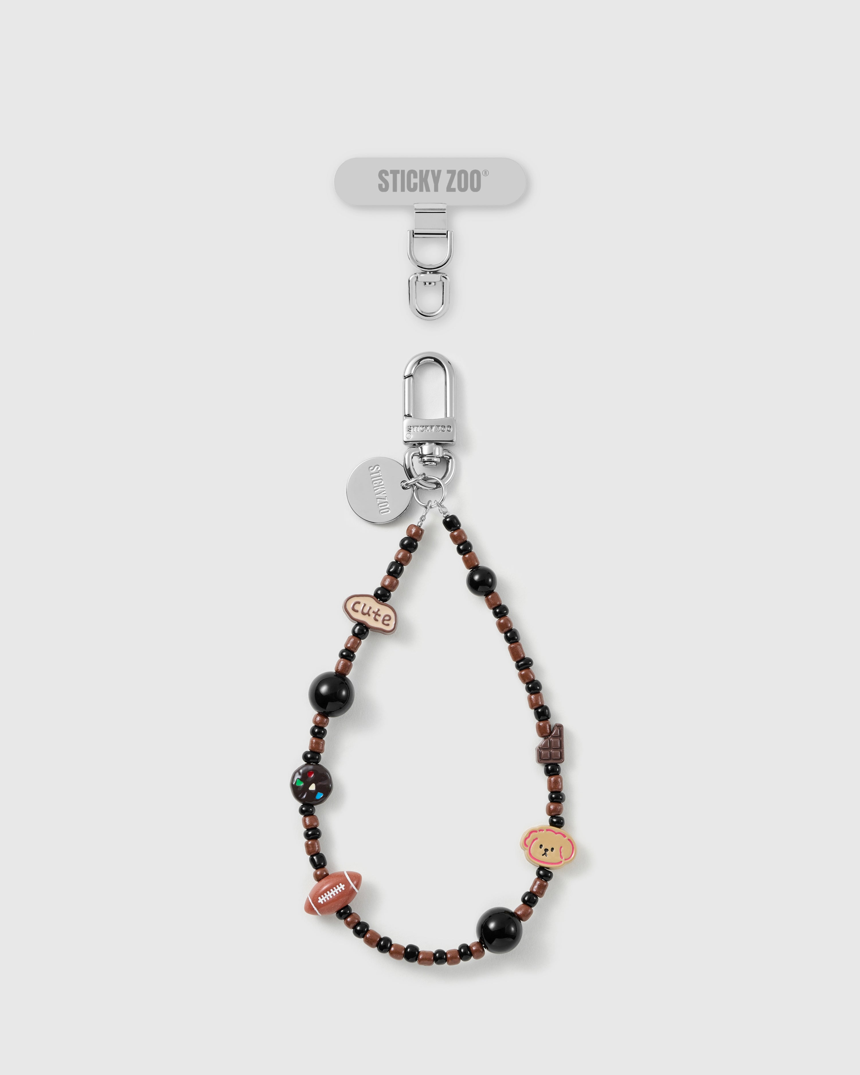 Handmade puppy-and-treats charm phone strap by STICKYZOO with silver-tone engraved hardware