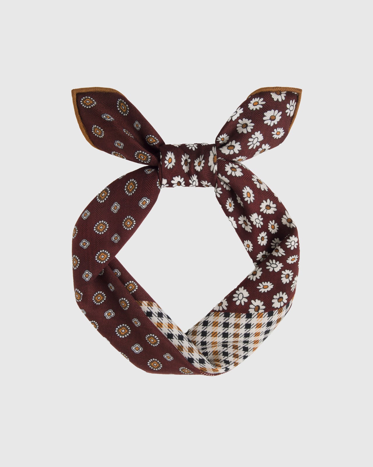 Oxblood silk patchwork scarf tied at the top showing the daisy field and foulard medallion grid