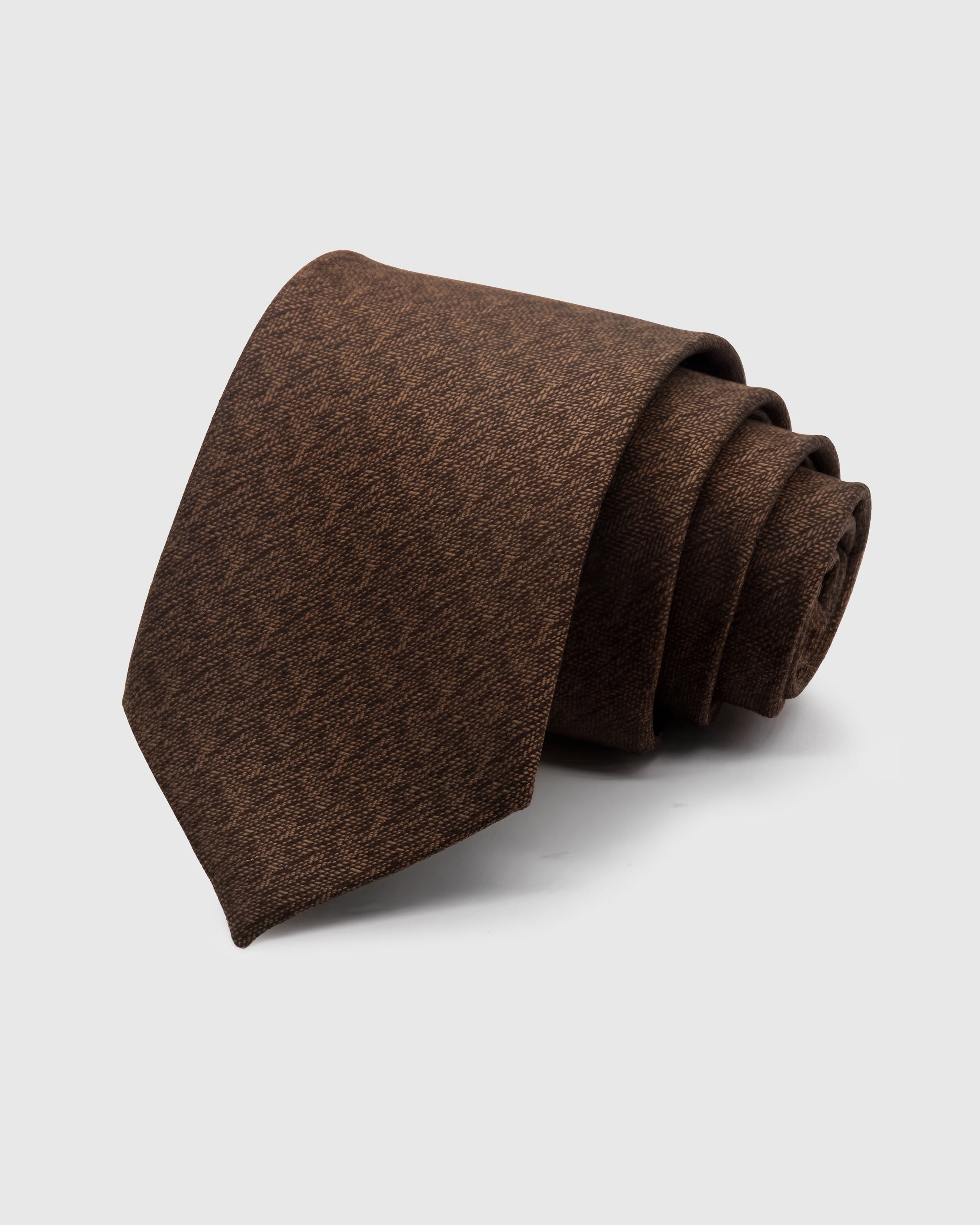 WALNUT TWEED TIE — Hand-embroidered textured solid detail on 100% mulberry silk in walnut brown, showing embroidery texture and silk sheen