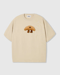 Collection flat-lay of STICKYZOO croissant t-shirts showing multiple colorways