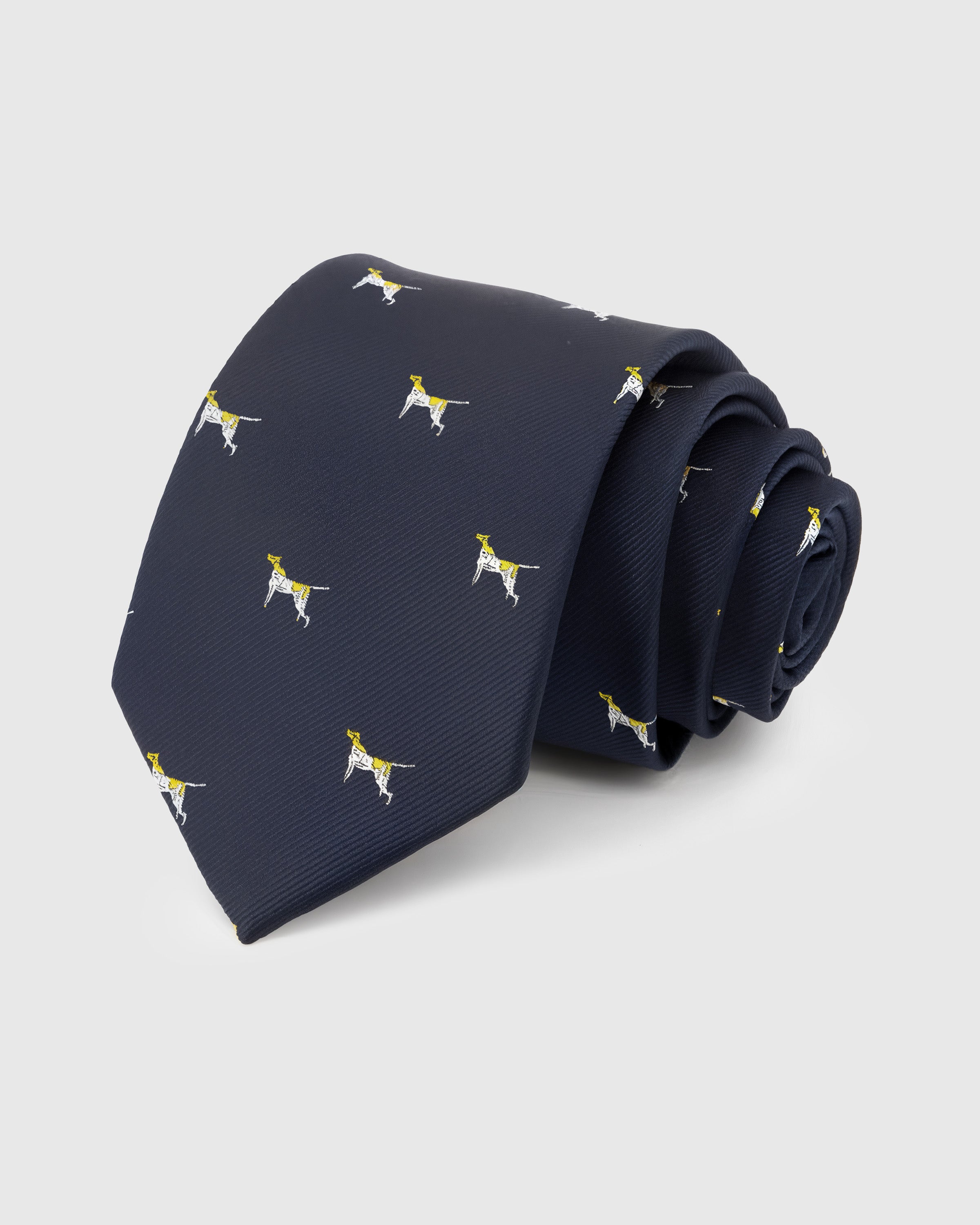 NAVY POINTER TIE — Hand-embroidered dog detail on 100% mulberry silk in navy, showing embroidery texture and silk sheen