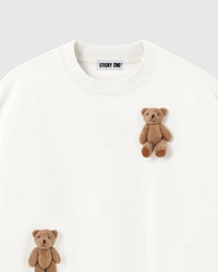 Close-up of dual plush teddy bears on white 450gsm cotton fleece showing 3D texture