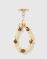 Handmade honey marbled bead phone strap by STICKYZOO with 18K gold-plated engraved hardware
