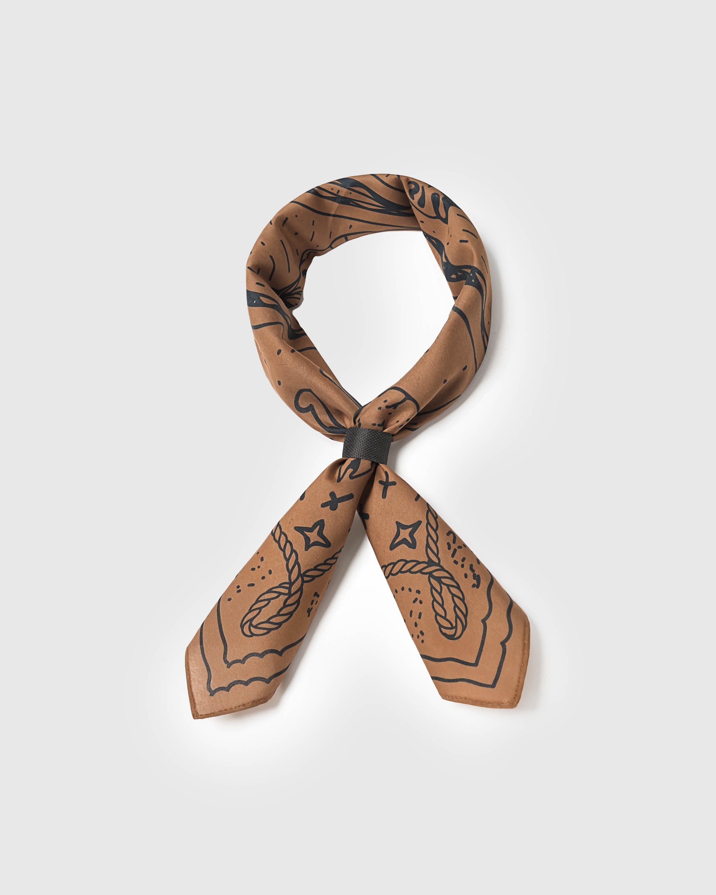 Western bridle silk scarf looped through a scarf ring showing the soft drape of pure silk
