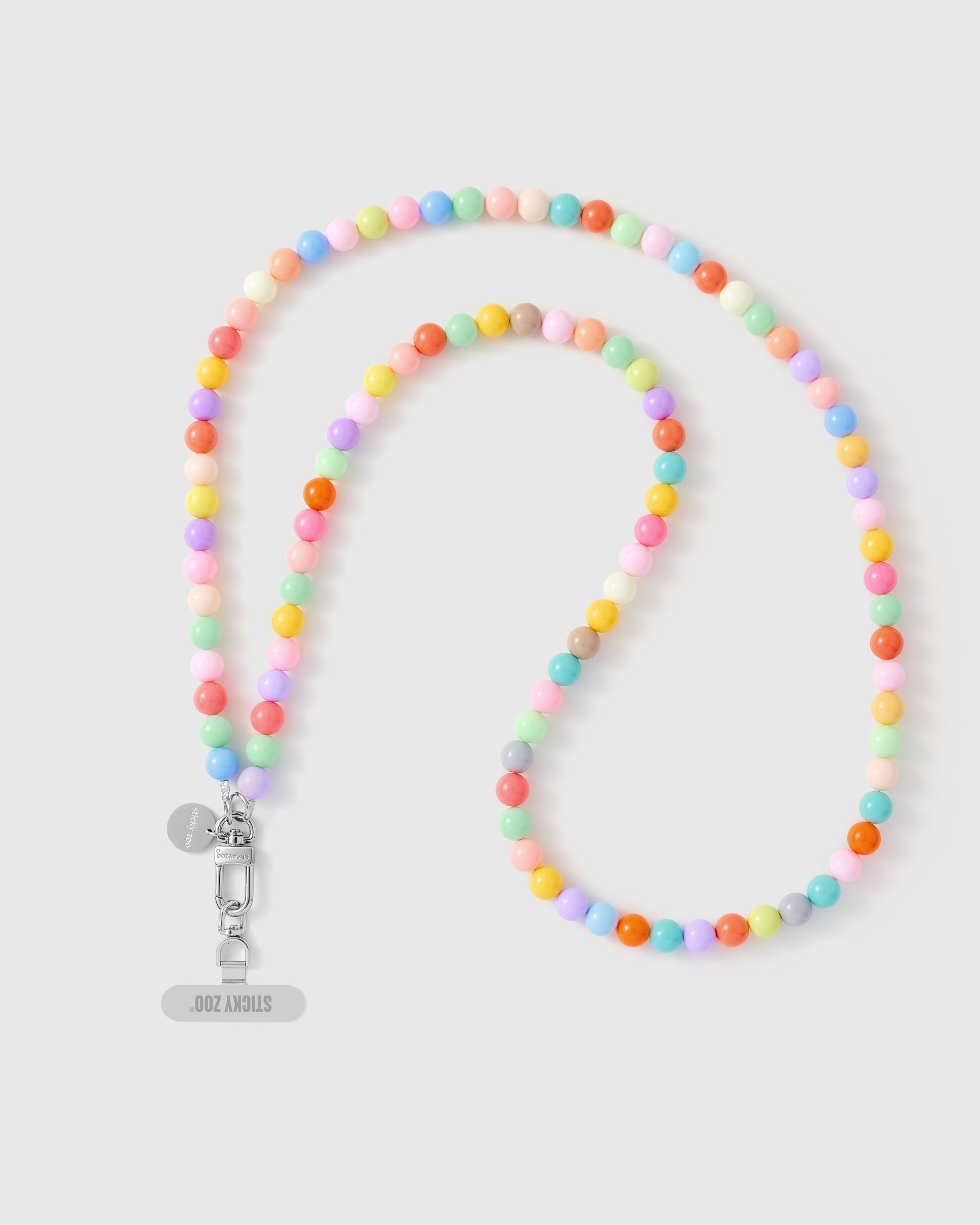 Handmade pastel cross-body phone strap with soft glossy beads and a silver engraved STICKYZOO charm.