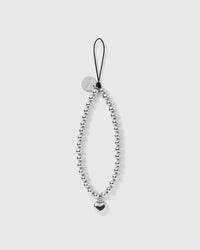STICKYZOO silver-tone beaded phone strap laid flat, a full loop of round beads with one puffy heart drop and a black cord loop up top