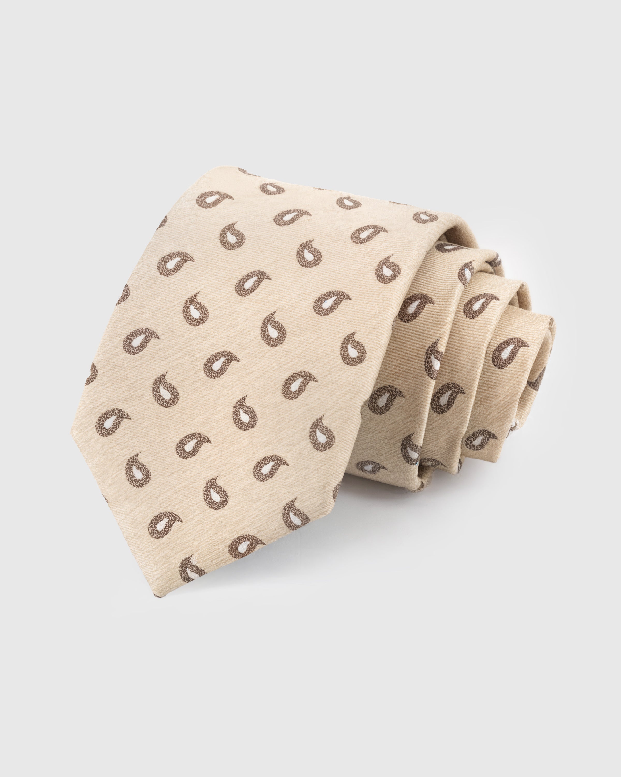 STICKYZOO Sand Paisley Tie in hand-embroidered mulberry silk with walnut paisley drops on warm beige ground, 45° bias-cut Italian method