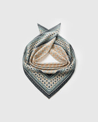 Silk mosaic scarf coiled to show the central tile field and concentric geometric borders