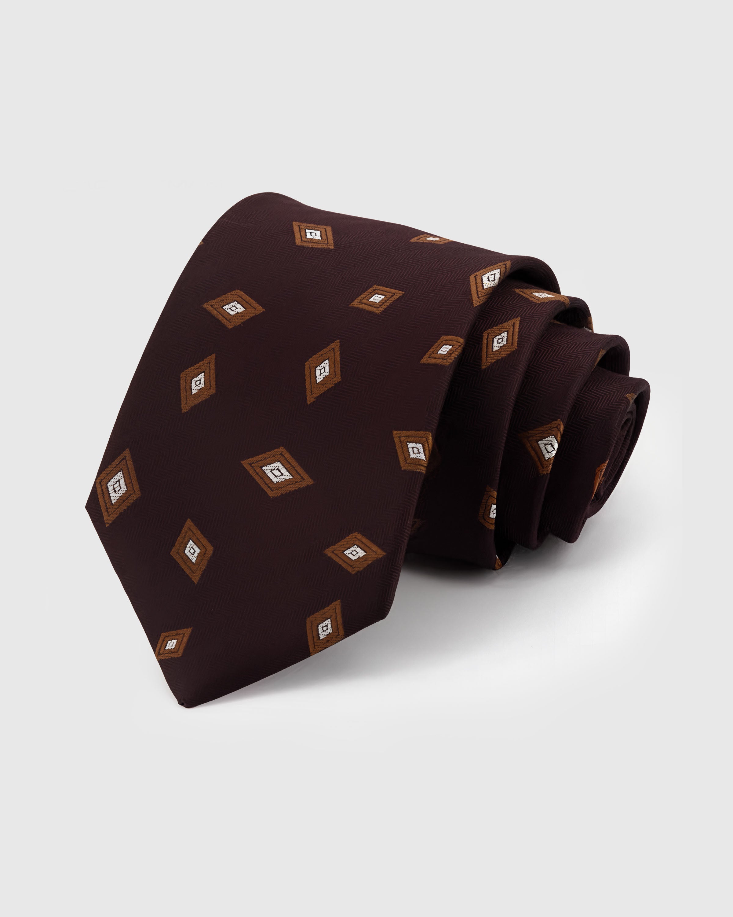 STICKYZOO Plum Lozenge Tie in hand-embroidered mulberry silk with gold lozenge motifs on plum herringbone ground, 45° bias-cut Italian method