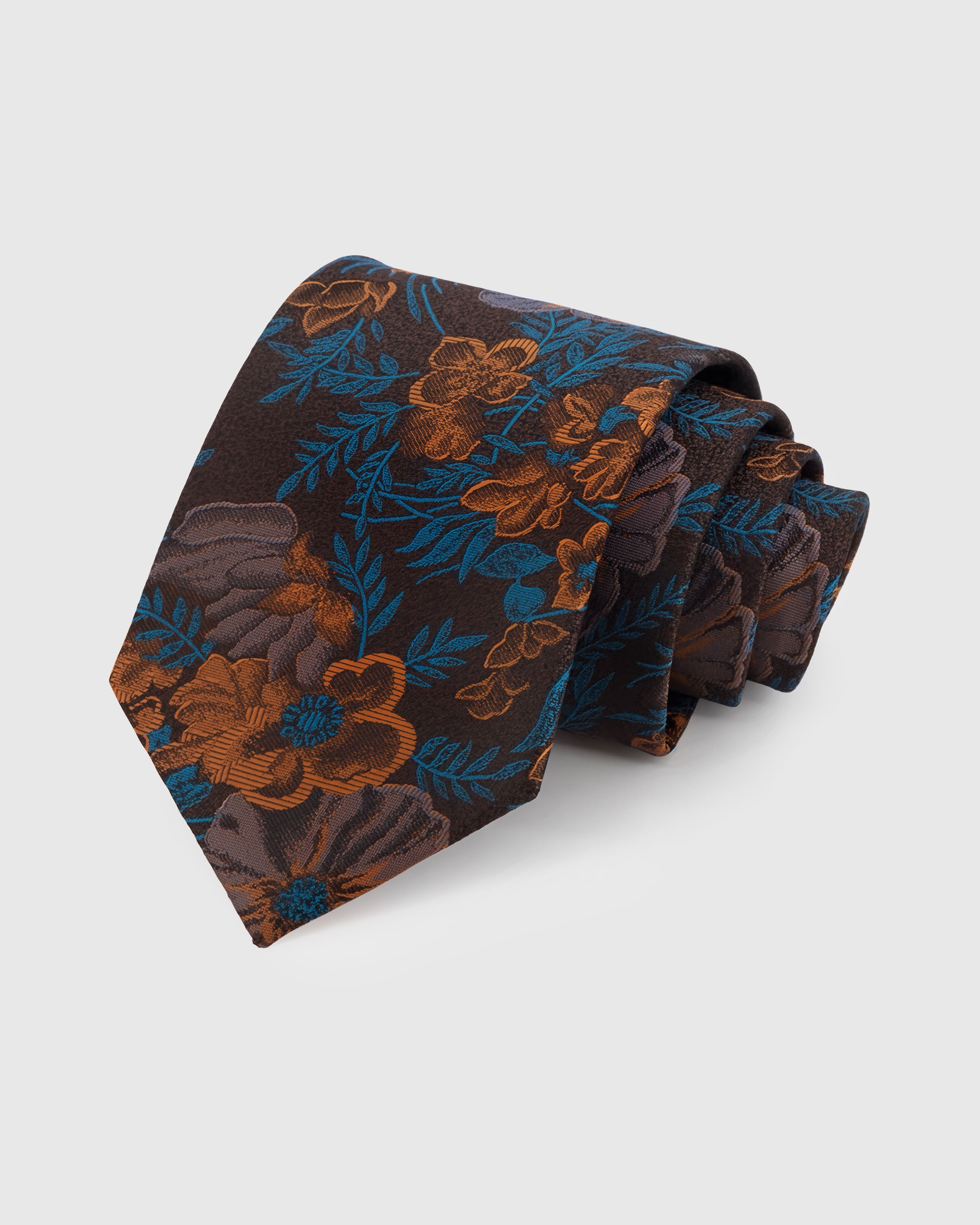 STICKYZOO UMBER TROPICANA TIE — 100% mulberry silk with hand-embroidered teal and copper tropical floral blooms on deep chocolate brown ground