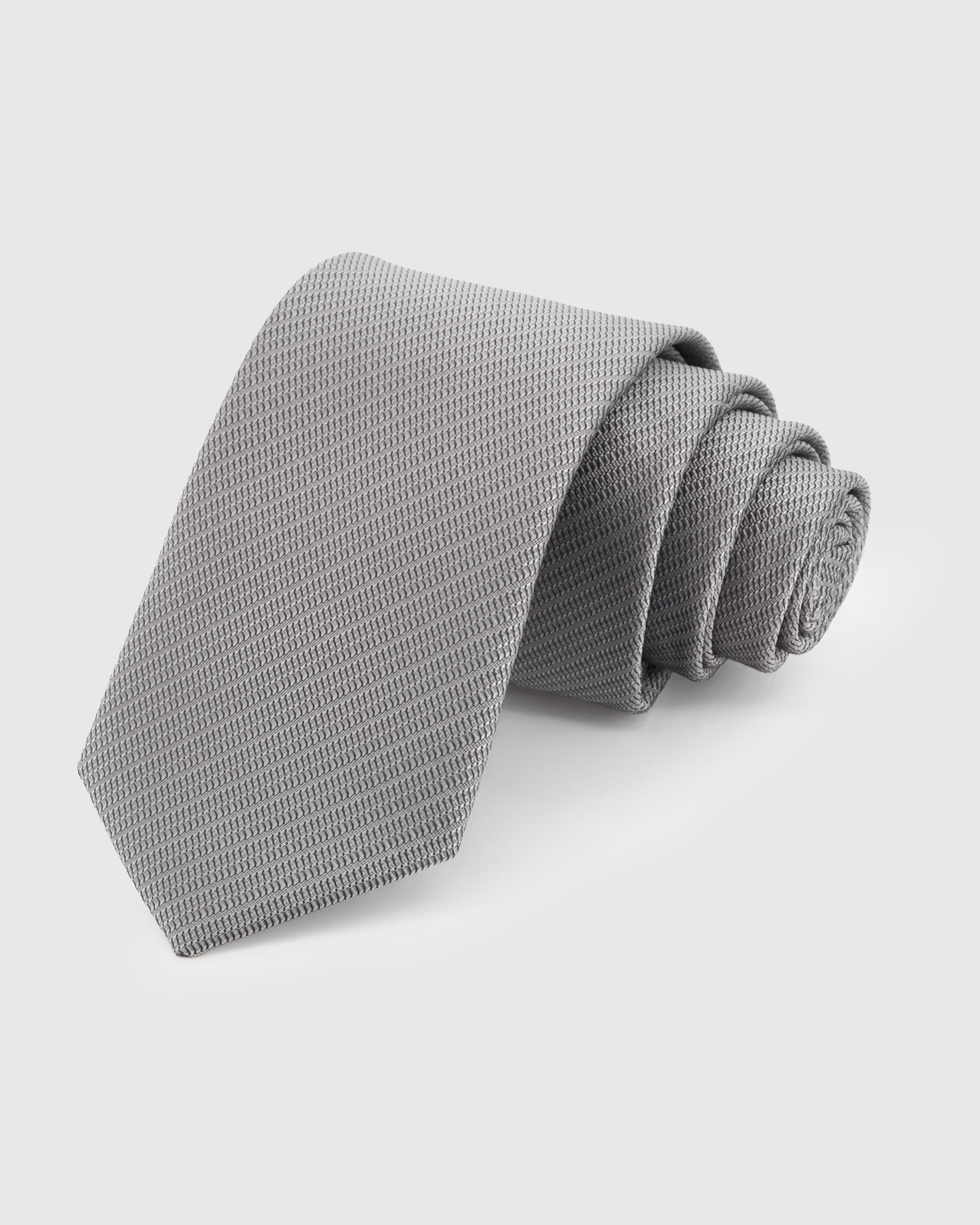 STICKYZOO Sterling Solid Tie in 100% mulberry silk with micro-piqué weave in sterling grey, 45° bias-cut Italian method