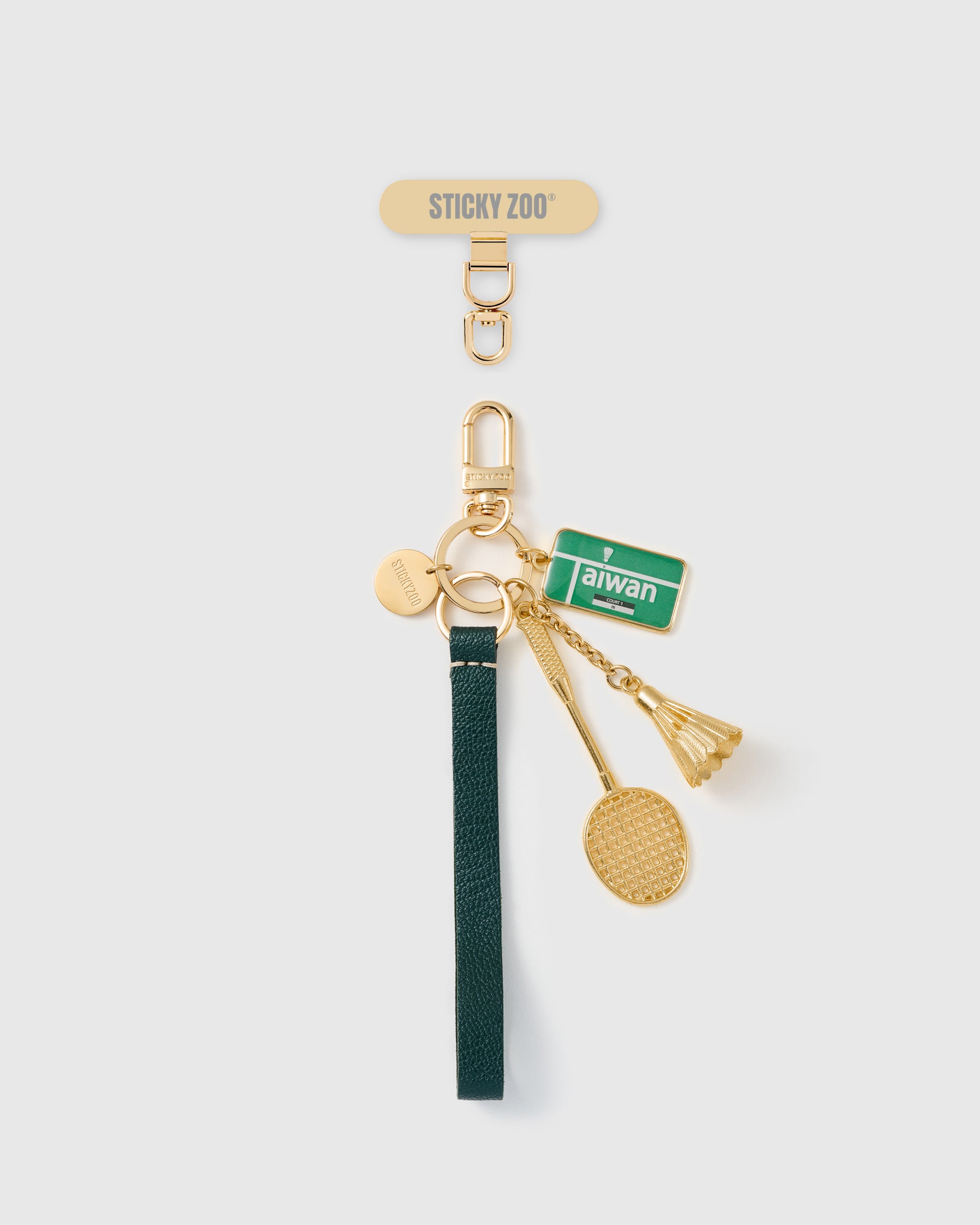 Handmade French Alran forest green leather phone strap with Taiwan enamel badge, gold racquet and shuttlecock charms, 18K gold STICKYZOO hardware