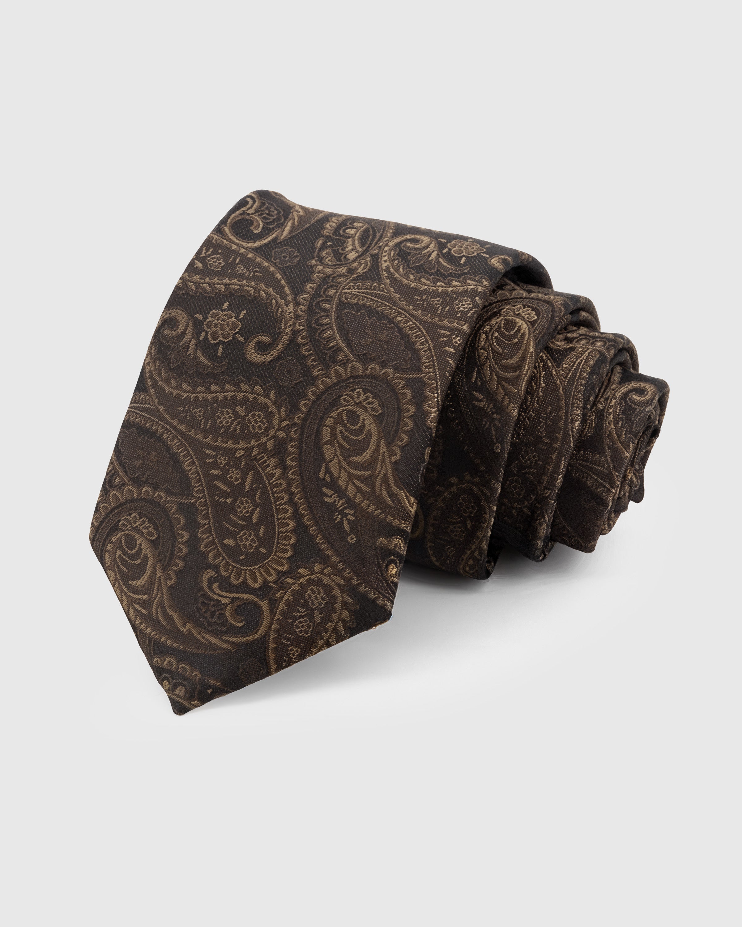 ESPRESSO PAISLEY TIE — Hand-embroidered paisley detail on 100% mulberry silk in espresso, showing embroidery texture and silk sheen