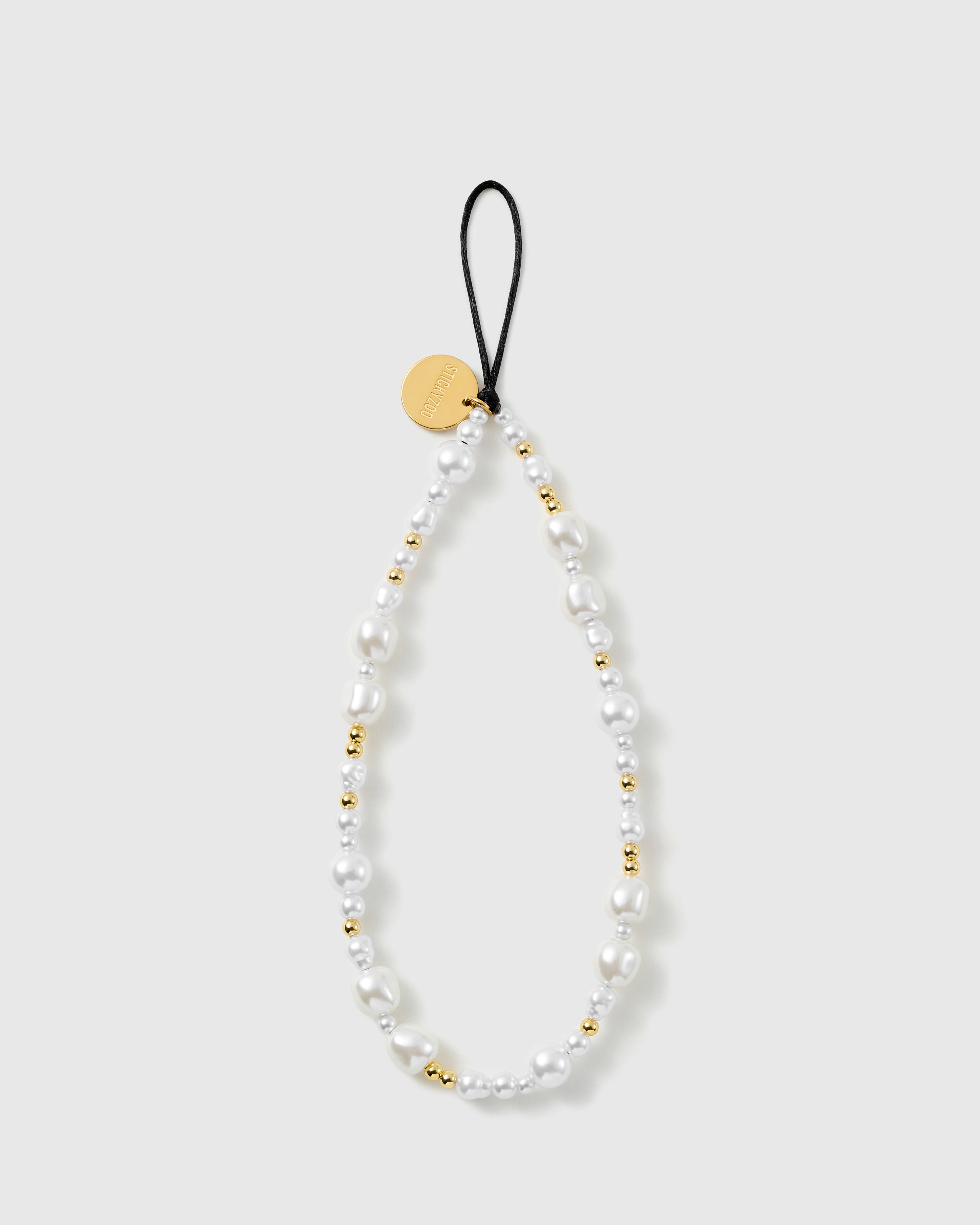 STICKYZOO Gilded Pearl phone strap laid flat: white baroque faux-pearls and gold-tone ball beads on a black stretch-cord loop with a gold disc.