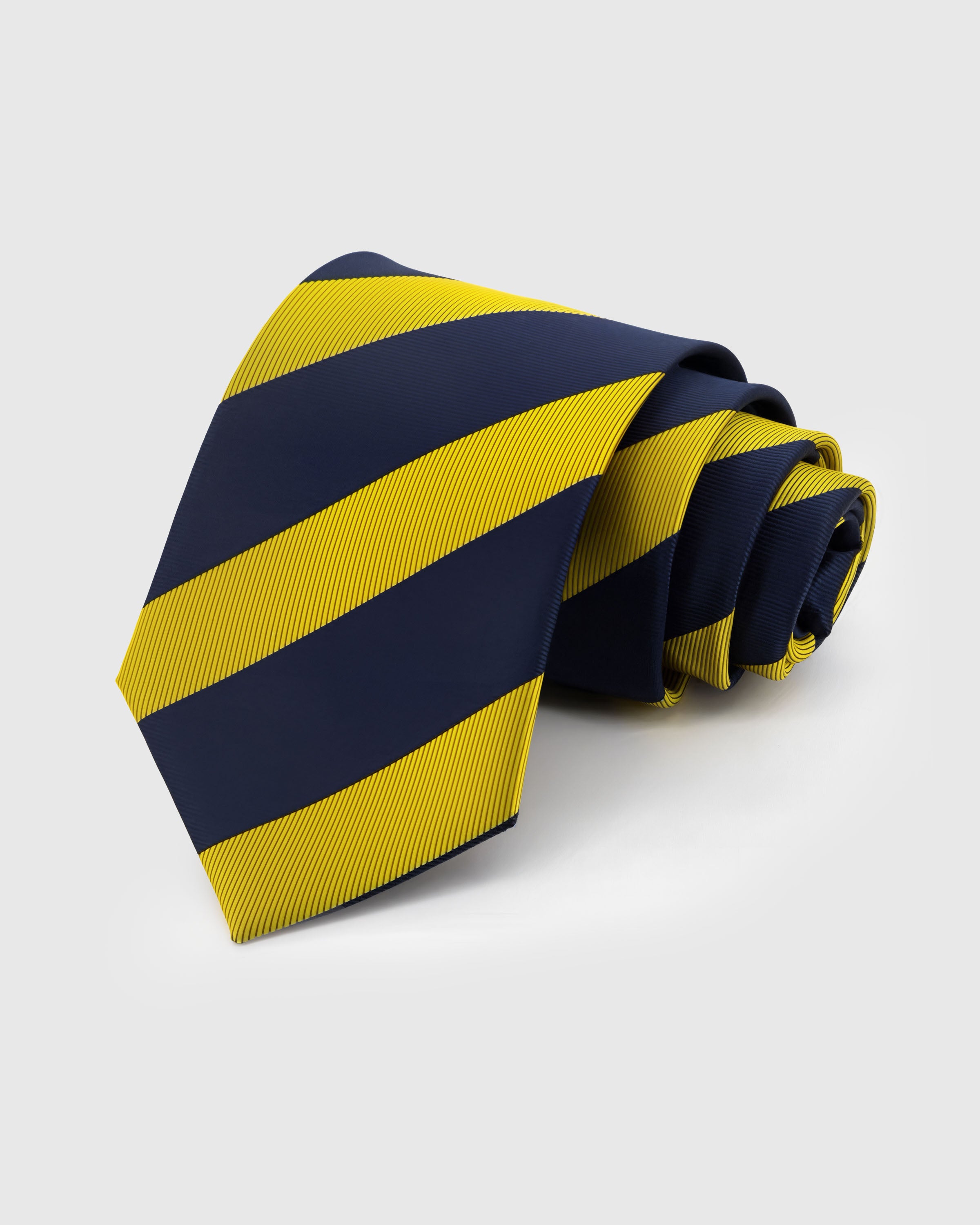 STICKYZOO Saffron Band Tie in hand-embroidered mulberry silk with bold saffron and navy diagonal stripes, 45° bias-cut Italian method