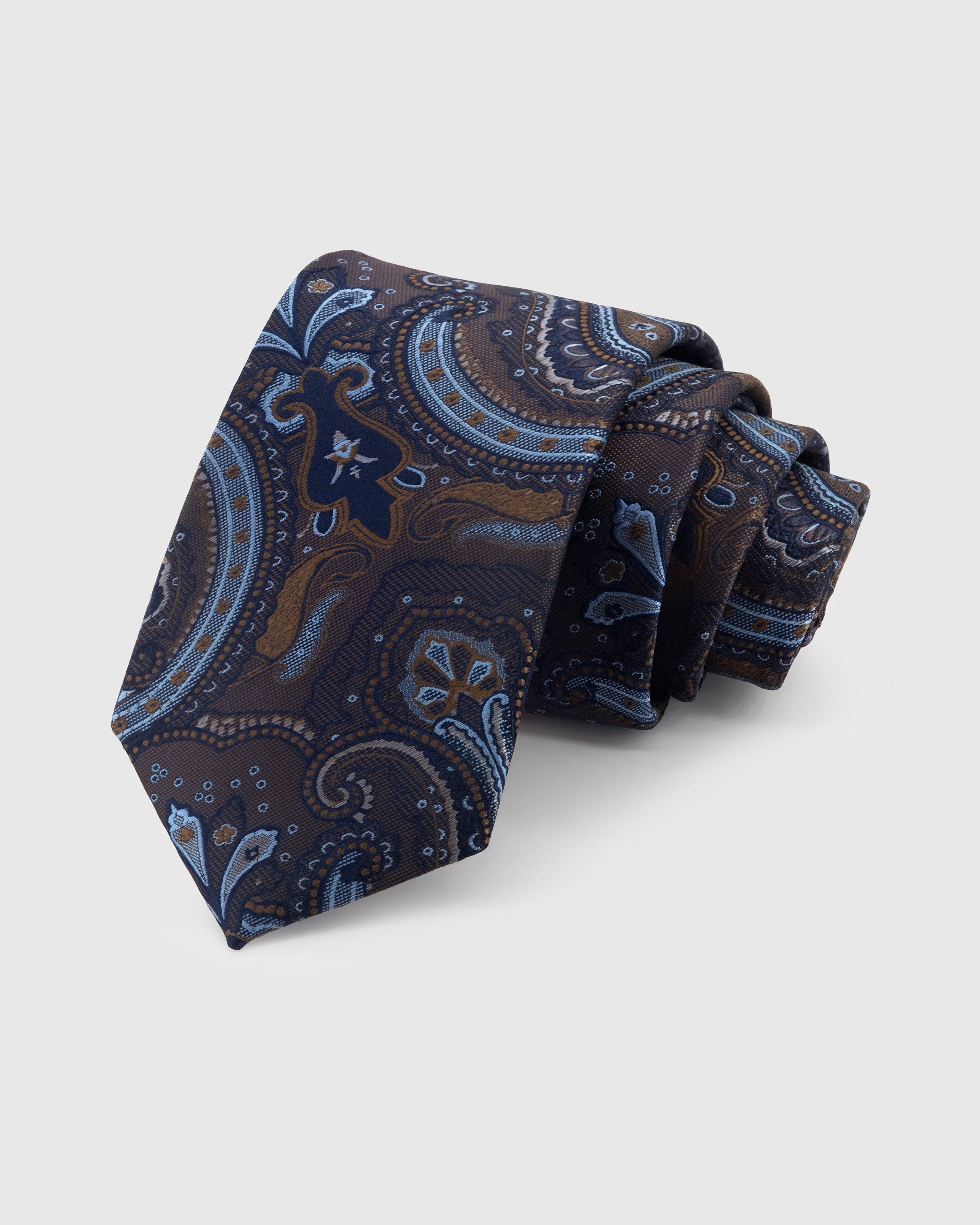 MIDNIGHT PAISLEY TIE — Hand-embroidered paisley detail on 100% mulberry silk in midnight, showing embroidery texture and silk sheen