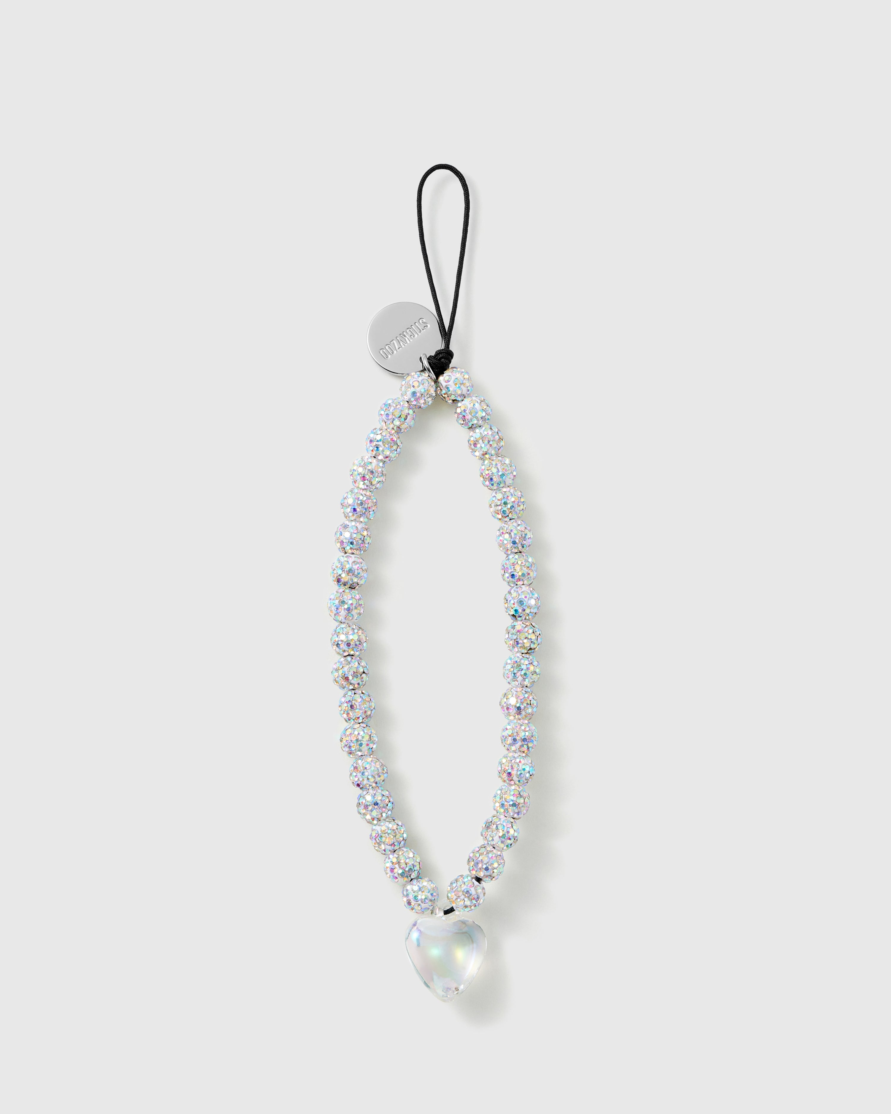 STICKYZOO Sparkle Heart phone strap laid flat, a loop of iridescent glitter beads with a clear heart drop and silver disc on a black cord.