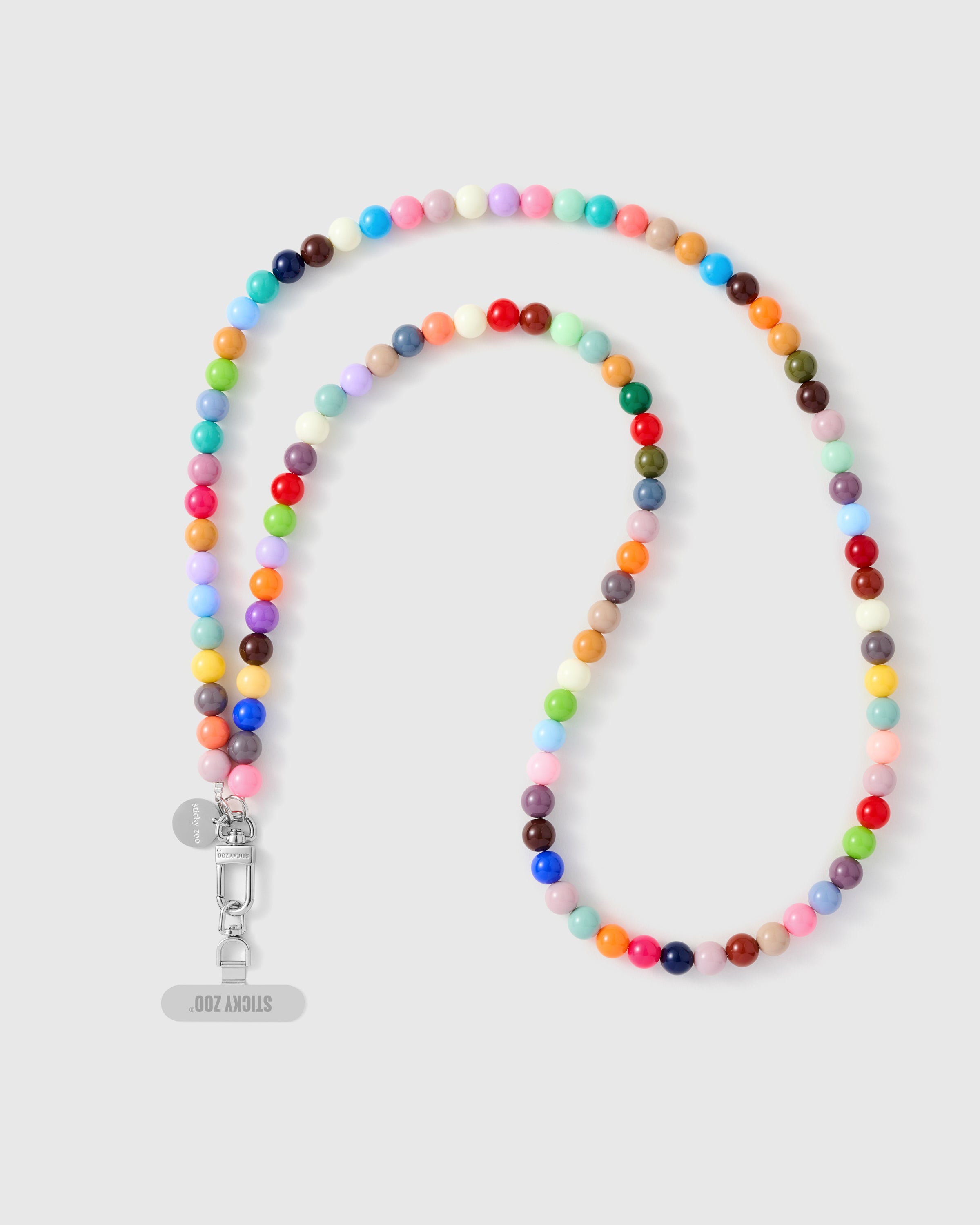 Handmade rainbow cross-body phone strap with glossy polished beads and a silver engraved STICKYZOO charm.