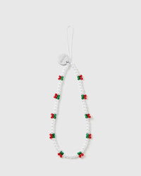STICKYZOO holly-berry phone strap laid flat: white faux-pearl beads with red-and-green berry clusters and a silver-tone engraved disc.