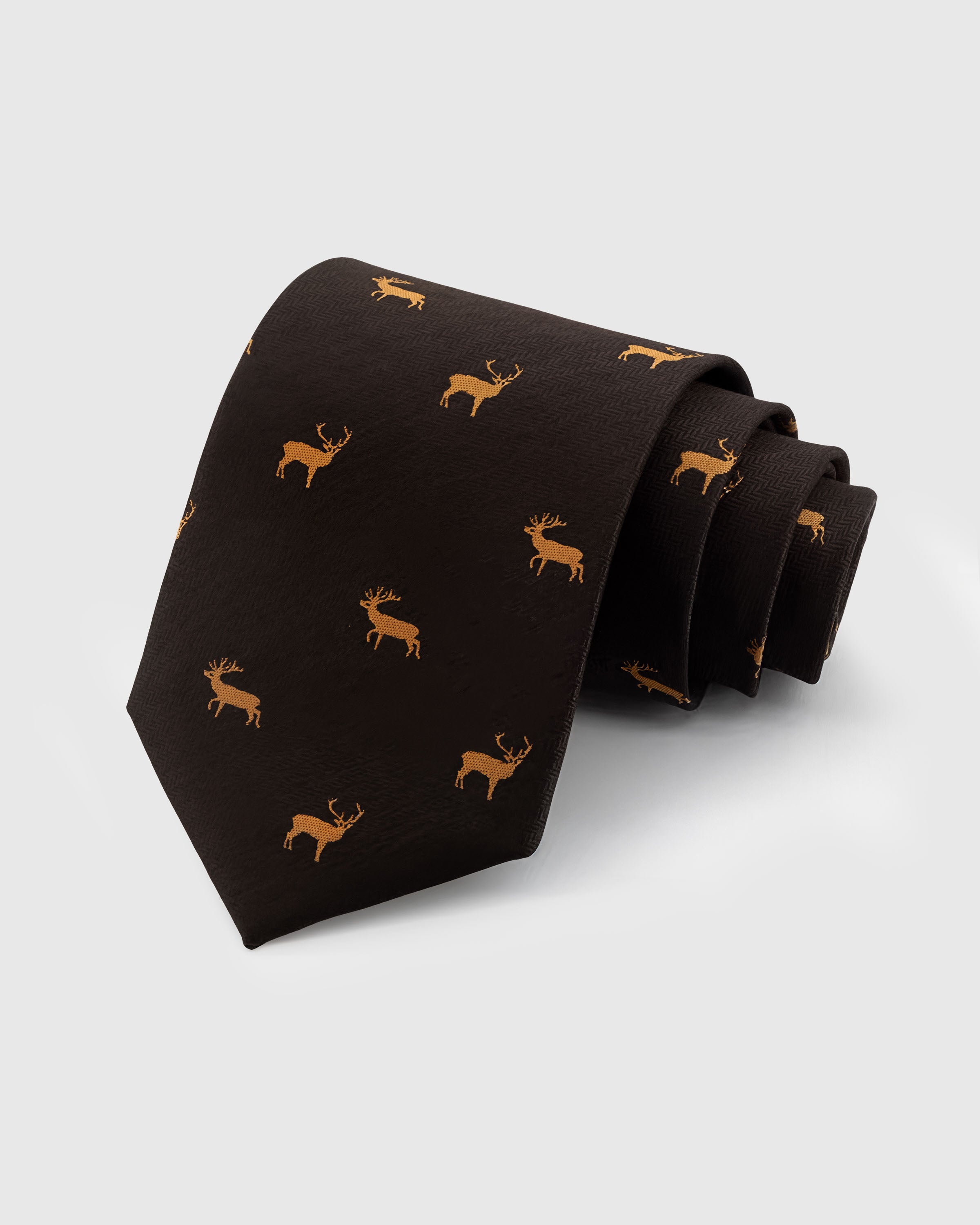 STICKYZOO ESPRESSO STAG TIE — 100% mulberry silk with hand-embroidered golden embroidered stag silhouettes on deep espresso brown with herringbone texture ground