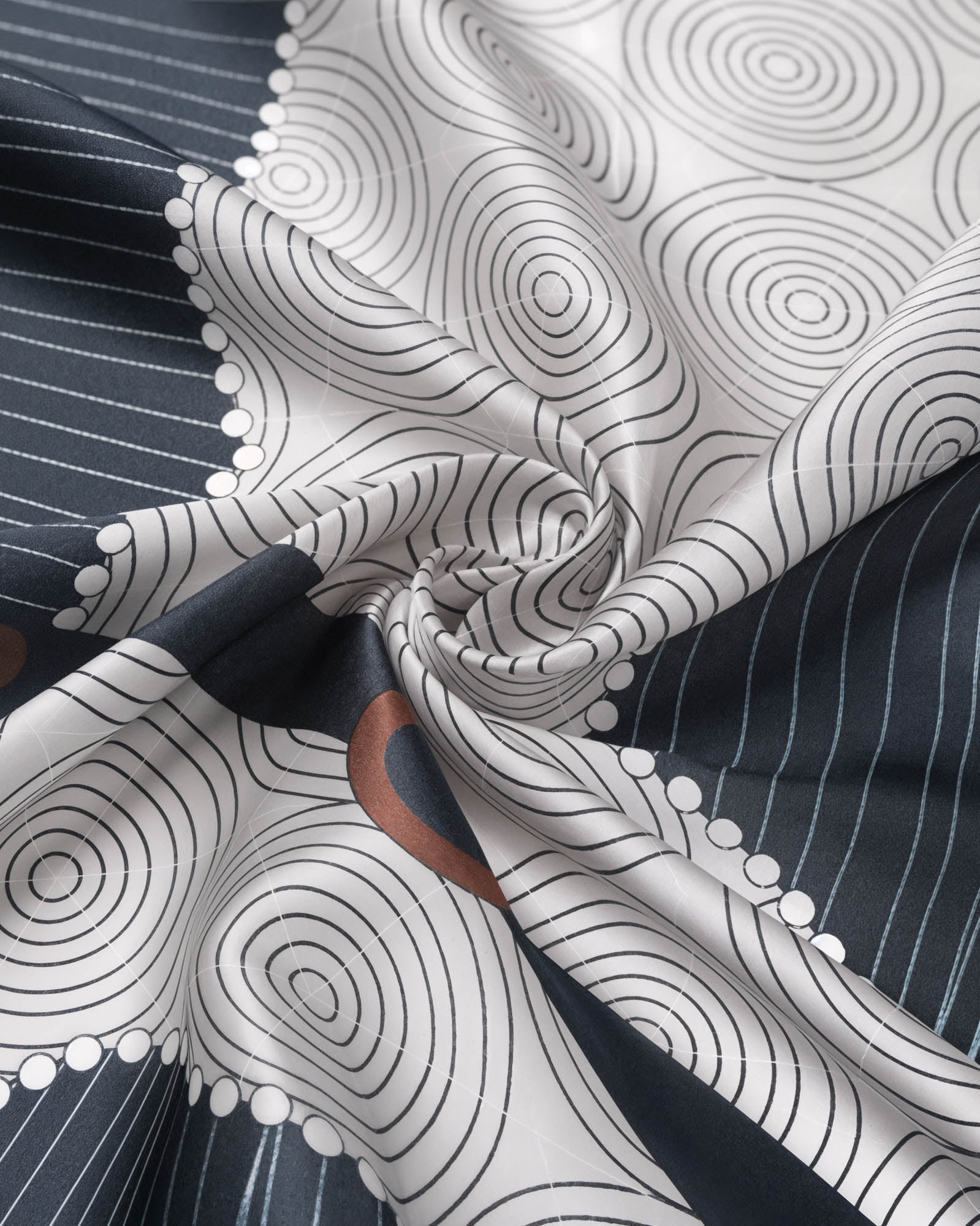 Cognac border meeting the ivory fish-scale band on the navy horse silhouette silk scarf
