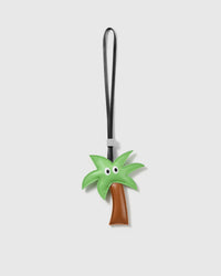 Handmade green French Alran leather palm tree bag charm with engraved 18K gold-plated hardware by STICKYZOO