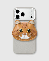 French Alran leather British Shorthair cat charm hand-stitched and layered on a vegan leather phone case in light grey with pebbled texture.