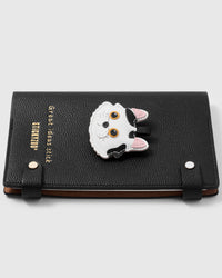 French Alran leather dragon li cat charm detail showing hand-cut and hand-stitched layers with engraved gold-plated hardware