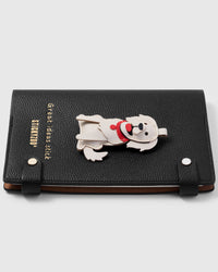 French Alran leather golden retriever charm detail showing hand-cut and hand-stitched layers with engraved gold-plated hardware