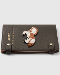 French Alran leather horse charm detail showing hand-cut and hand-stitched leather layers on STICKYZOO notebook