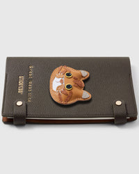 French Alran leather British Shorthair cat face with round cheeks on STICKYZOO notebook, hand-cut and stitched with multi-layer construction