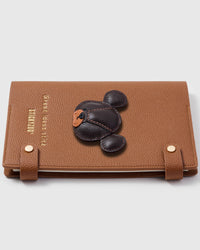 French Alran leather bear charm detail showing hand-cut and hand-stitched leather layers on STICKYZOO notebook