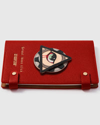 French Alran leather all-seeing eye charm detail showing hand-cut and hand-stitched leather layers on STICKYZOO notebook