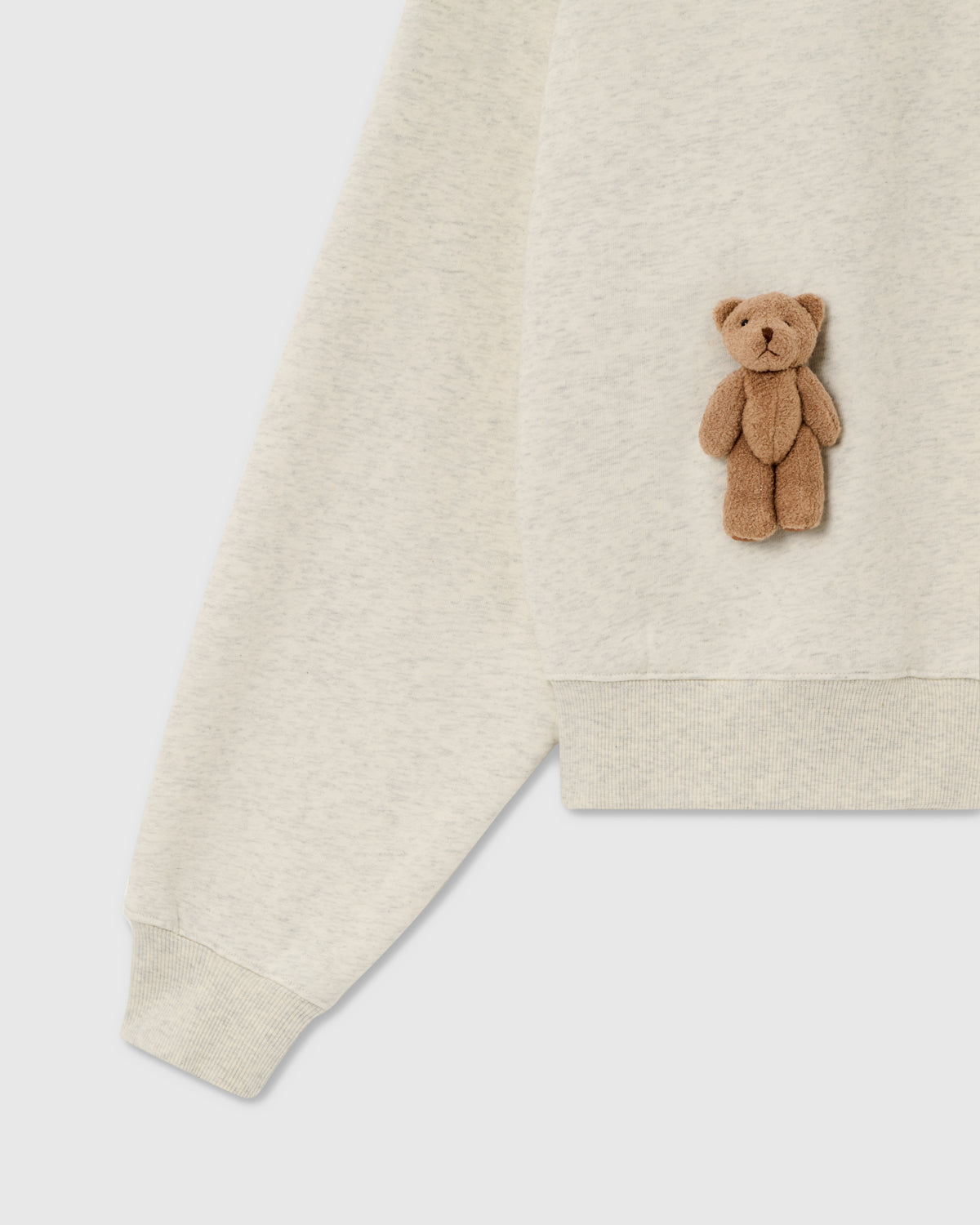 {{Kept by 99% of buyers}} Detail of plush teddy bear and ribbed cuff on light gray 450gsm cotton fleece