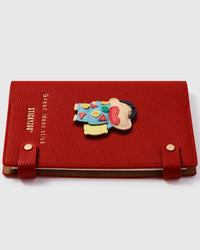 Layered leather Crayon Shinchan charm showing hand-cut colorful pajama detail and 3D character depth on STICKYZOO notebook
