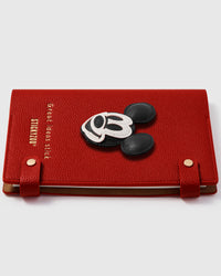 Mickey face charm detail showing hand-layered black and white leather pieces with 3D depth on STICKYZOO A5 refillable notebook