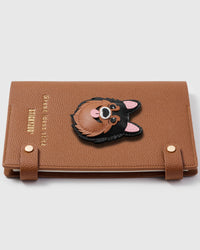 French Alran leather Pomeranian charm detail showing hand-cut and hand-stitched leather layers on STICKYZOO notebook