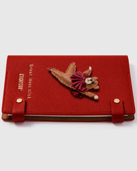 Ballet bear charm detail showing hand-layered brown leather bear in pink tutu, leaping pose on STICKYZOO A5 notebook