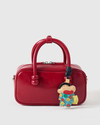 Classic Shinchan charm styled on a bag, front — a small, specific piece that turns a simple bag into a personal one.