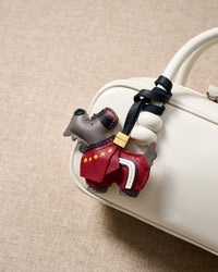 Wear the Scottish Terrier charm on a bag with the leather strap loop, or clip it to keys with the 18K gold-plated keychain clip.