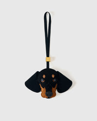 Handmade Dachshund suede bag charm by STICKYZOO — hand-cut, hand-stitched, hand-layered French Alran suede over 5 days. Suede edition. Designed in Amsterdam.