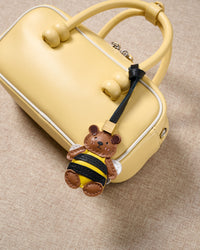 Honeybuzz Bear on an 18K gold-plated keychain clip with engraved STICKYZOO disc — clips to keys, bags or backpacks.