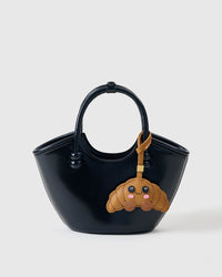 Every panel of the crispy croissant mood charm is cut by hand and stitched through real French leather. Layered slowly for depth — no prints, no stamps.