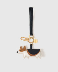 Wear the corgi charm on a bag with the leather strap loop, or clip it to keys with the 18K gold-plated keychain clip.