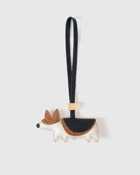 Corgi charm handmade from French Alran genuine goatskin and French suede — real full-grain leather from Tarn, since 1903. 3 days of hand-cutting, hand-stitching, hand-layering. Arrives in luxury gift packaging. Designed in Amsterdam.
