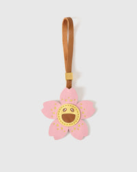 STICKYZOO Bloomy Sakura Charm — soft pink French Alran goatskin cherry blossom petals with golden smiley face and yellow dot accents. 3-day handmade piece.